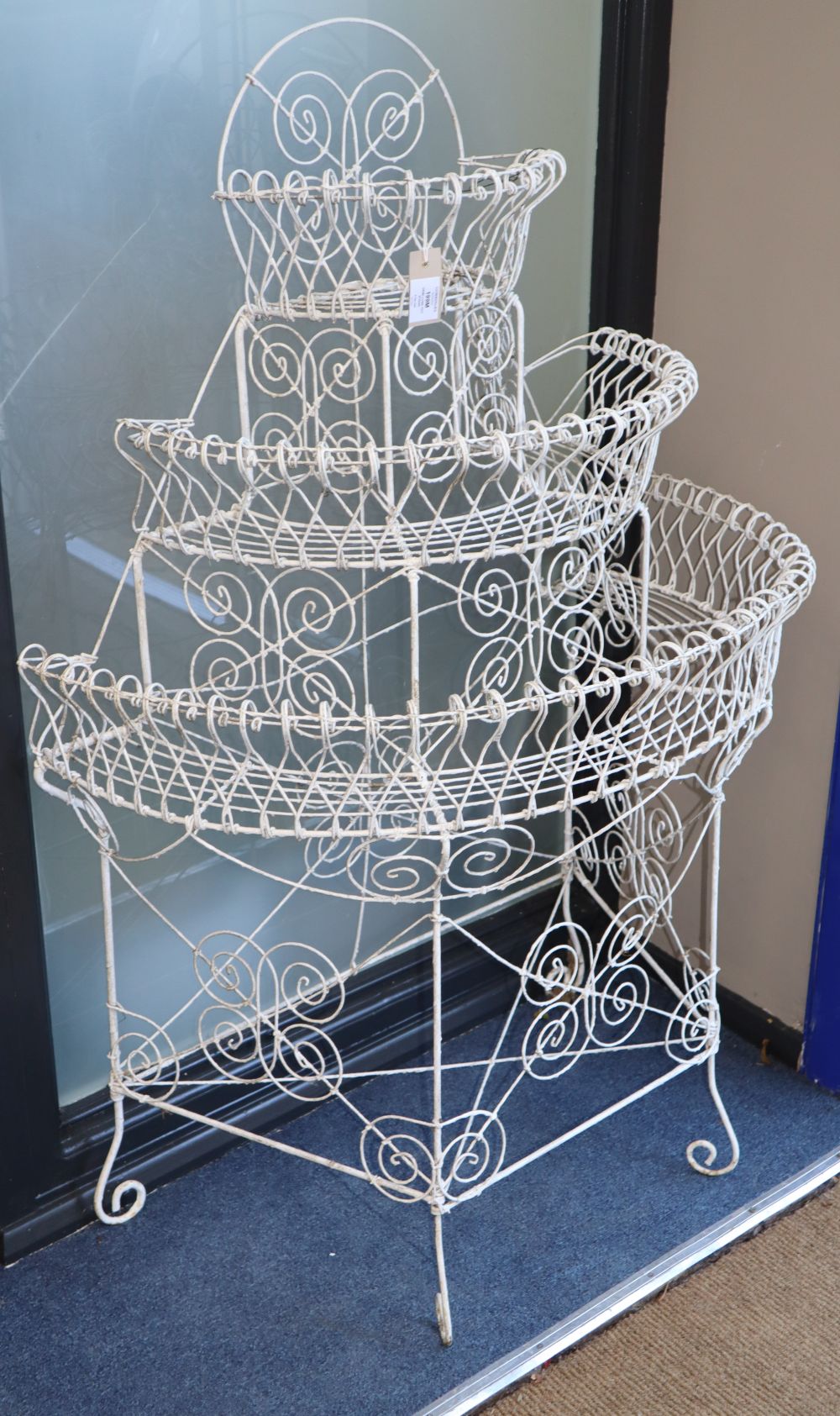 A Victorian wire-work demi lune pot stand, W.84cm, D.50cm, H.128cm